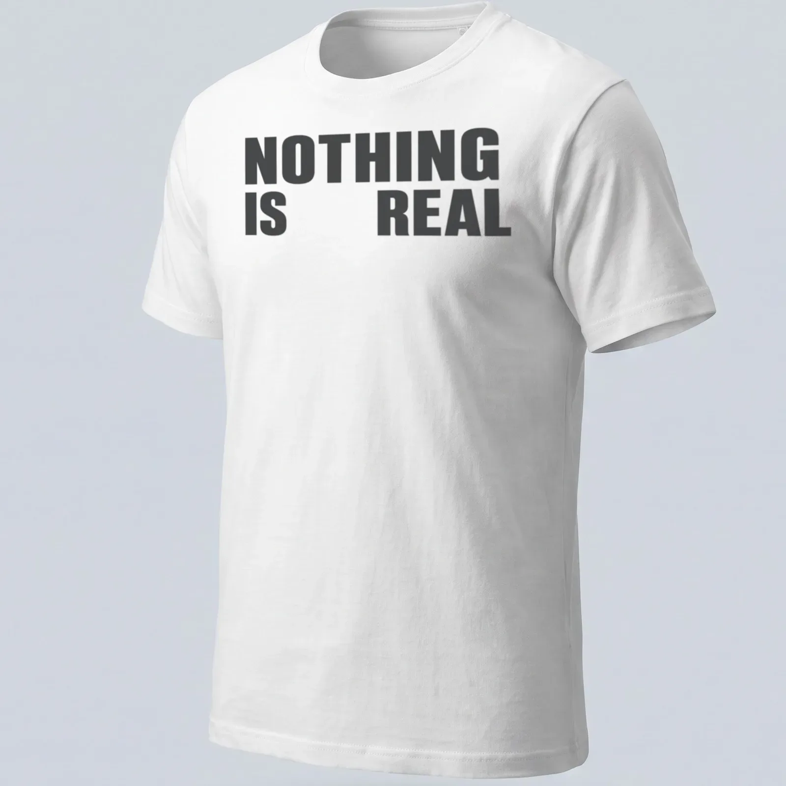 Minimalist typography t-shirt with black and white design stating 'NOTHING IS REAL' — printed on a unisex t-shirt