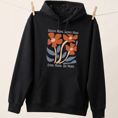 Colorful floral design featuring the text 'Dream More, Learn More, Care More, Do More' — printed on a unisex hoodie