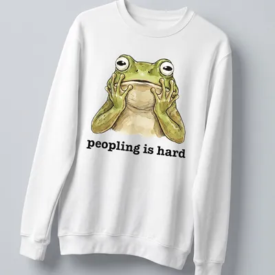 Cartoon frog with text 'peopling is hard' in a funny introvert — printed on a unisex sweatshirt