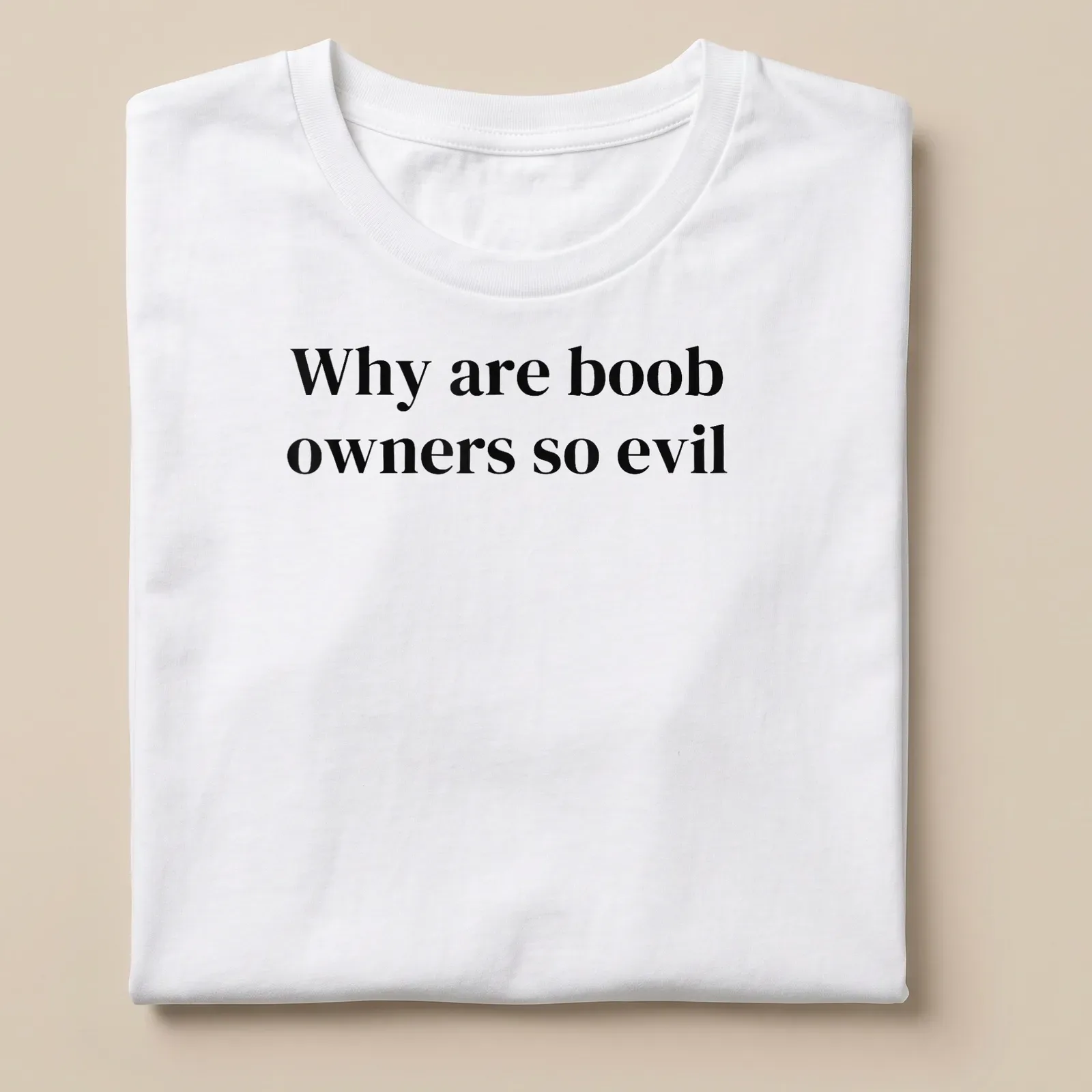 Bold typography t-shirt with the text 'Why are boob owners so evil' in black and white. — printed on a unisex t-shirt