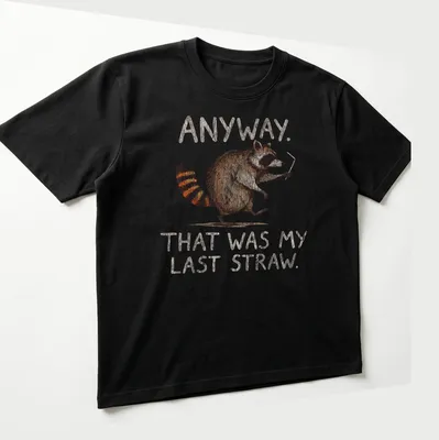 Whimsical illustration of a raccoon with text: Anyway. That was my last straw. — printed on a unisex t-shirt (angled view)