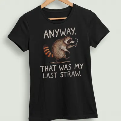 Whimsical illustration of a raccoon with text: Anyway. That was my last straw. — printed on a women's shirt
