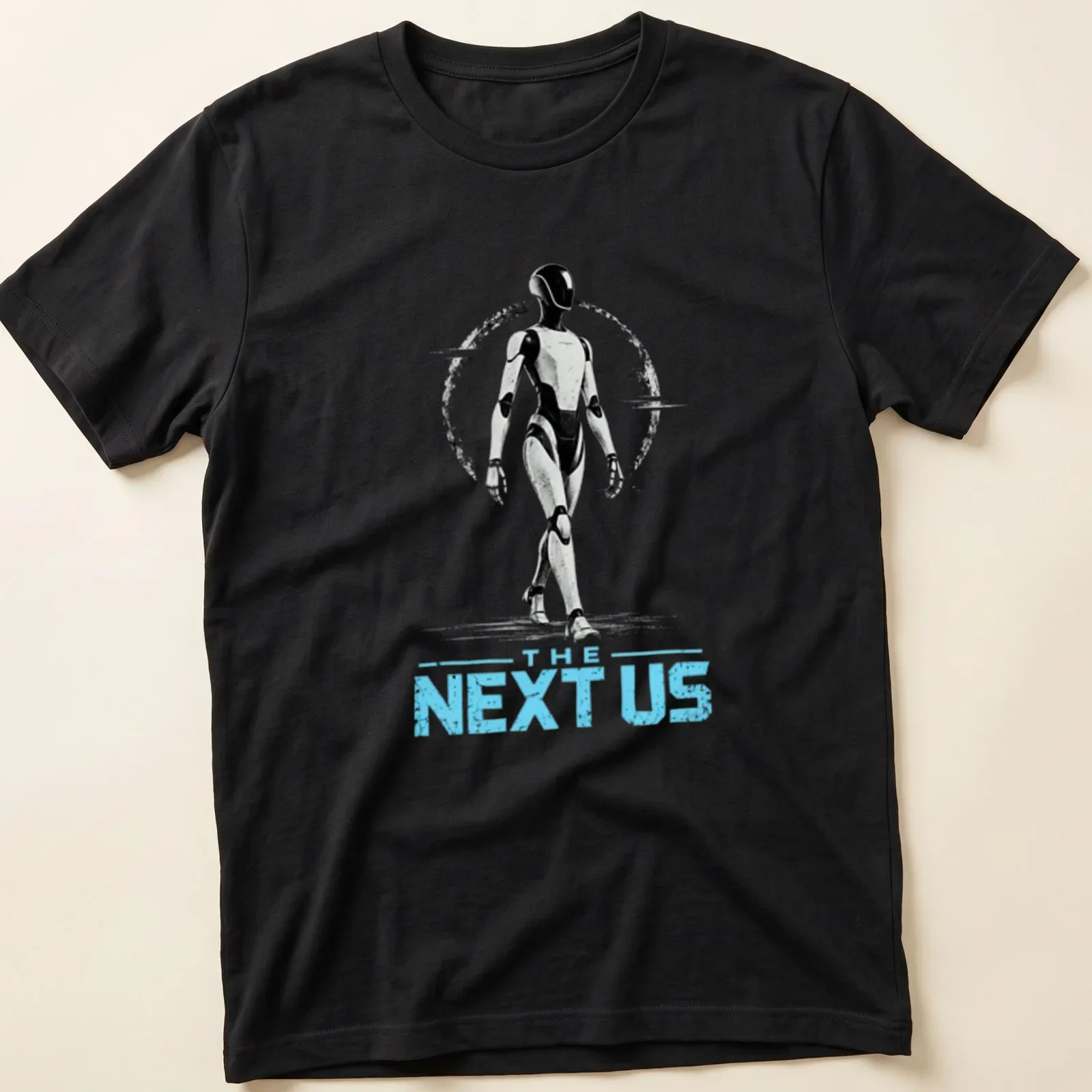 Silhouette of a futuristic humanoid robot with the text 'THE NEXT US' in bold font — printed on a unisex t-shirt