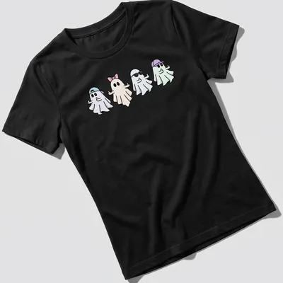 Kawaii style shirt with five cute ghosts in pastel colors and playful expressions — printed on a women's shirt