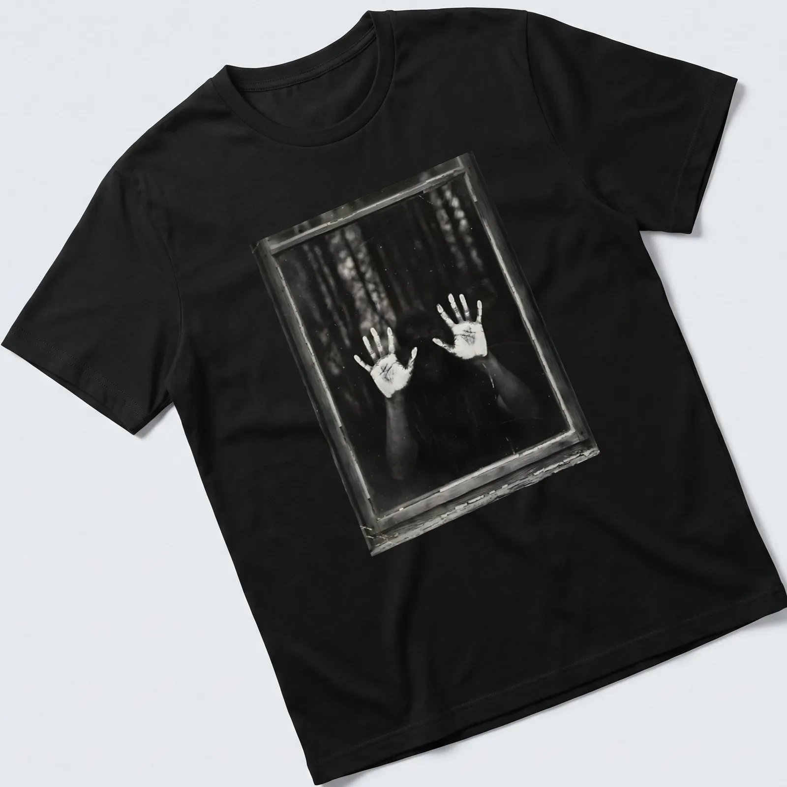 Illustration of ghostly hands emerging from a dark background in monochrome. — printed on a unisex t-shirt