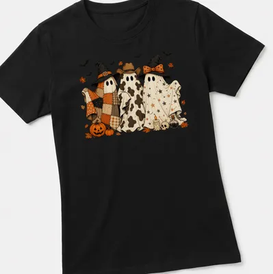 Whimsical ghosts in cowboy and witch hats in orange and black for Halloween — printed on a women's shirt