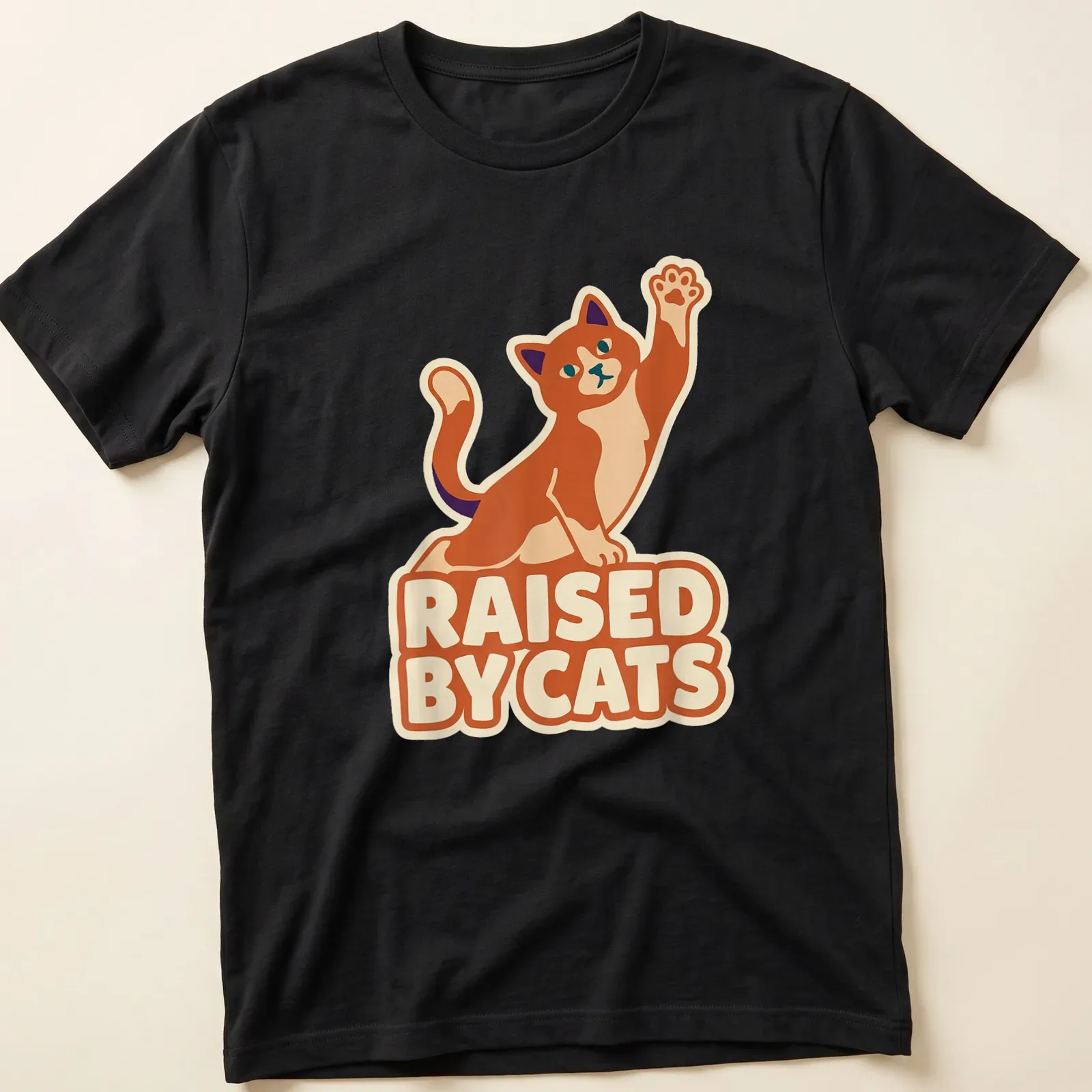Cartoon ginger cat giving a high five with the text 'Raised By Cats' in bright colors — printed on a unisex t-shirt