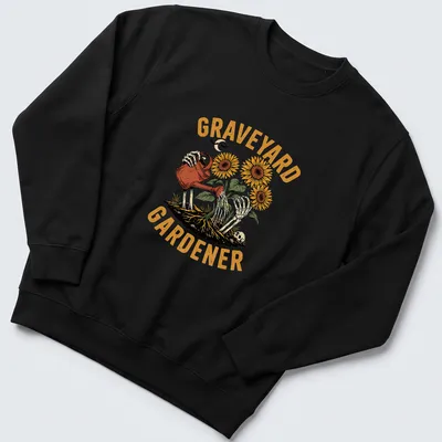 Vintage illustration of a skeleton watering sunflowers with the text 'GRAVEYARD GARDENER' — printed on a unisex sweatshirt