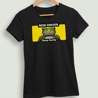 Cartoon green frog with text 'NEW DRIVER Beep Gently' in yellow and black — printed on a women's shirt