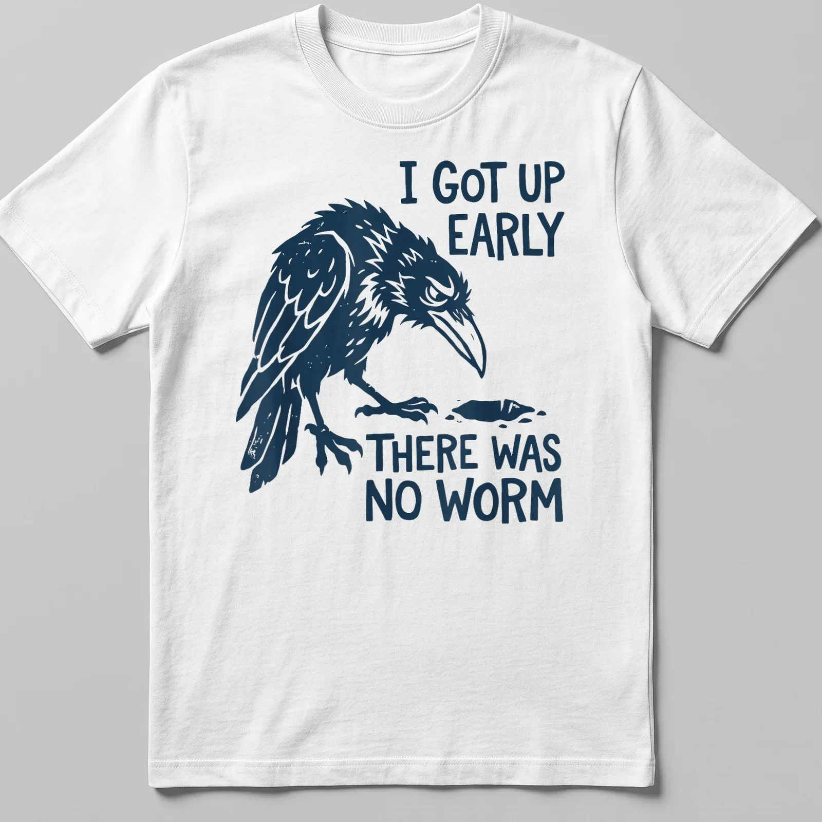 Bold illustration of a grumpy raven with text about early rising and no worm — printed on a unisex t-shirt