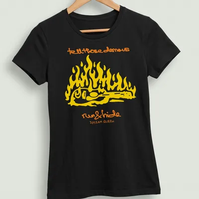 Bold line-art of a guitar surrounded by flames with text about demons. — printed on a women's shirt