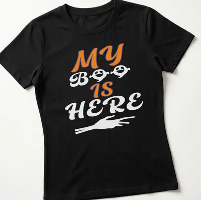 Playful Halloween ghost T-shirt with orange, black, and white colors — printed on a women's shirt