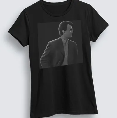 Monochrome illustration of a man in a suit in black, white, and gray — printed on a women's shirt