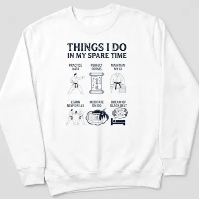 Bold white typography listing karate activities on navy blue — printed on a unisex sweatshirt