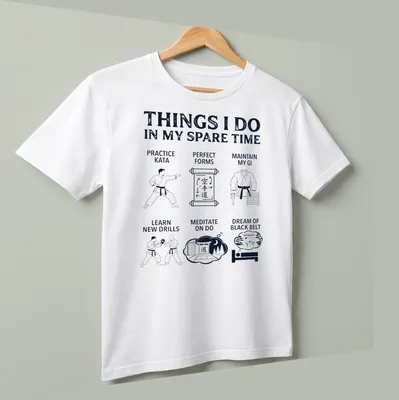Bold white typography listing karate activities on navy blue — printed on a unisex t-shirt (angled view)
