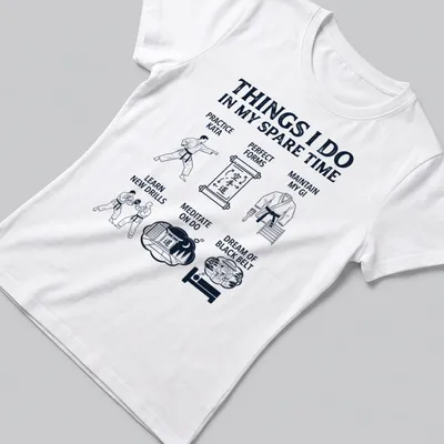 Bold white typography listing karate activities on navy blue — printed on a women's shirt