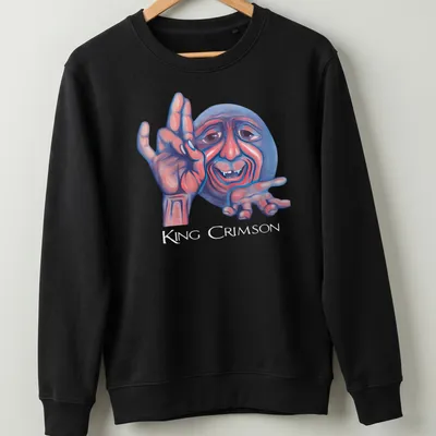 Colorful illustration of a smiling character with King Crimson text above — printed on a unisex sweatshirt