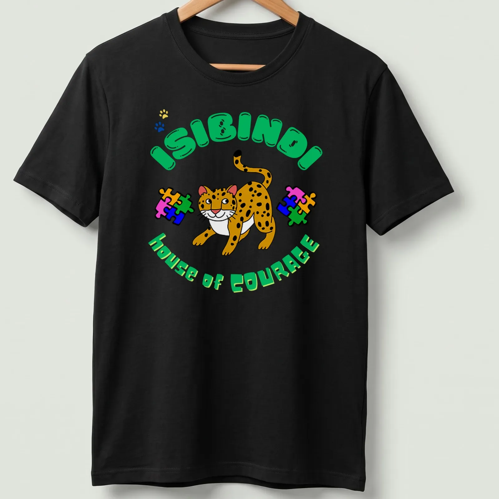 Colorful cartoon leopard design with 'ISIBINDI house of COURAGE' text — printed on a unisex t-shirt