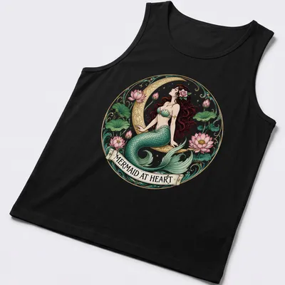 Vintage mermaid illustration with the text 'Mermaid At Heart' in teal and pink — printed on a tank top