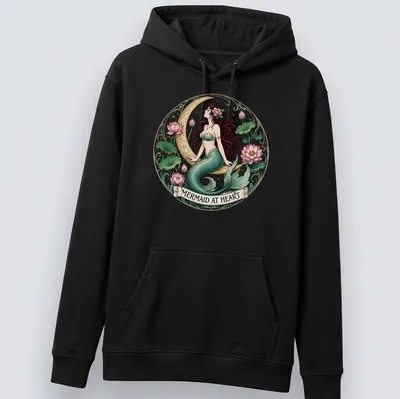 Vintage mermaid illustration with the text 'Mermaid At Heart' in teal and pink — printed on a unisex hoodie