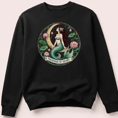 Vintage mermaid illustration with the text 'Mermaid At Heart' in teal and pink — printed on a unisex sweatshirt
