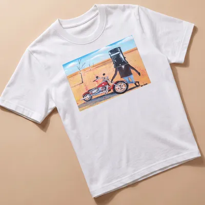 Colorful cartoon of Ned Kelly riding a motorcycle with playful text above.