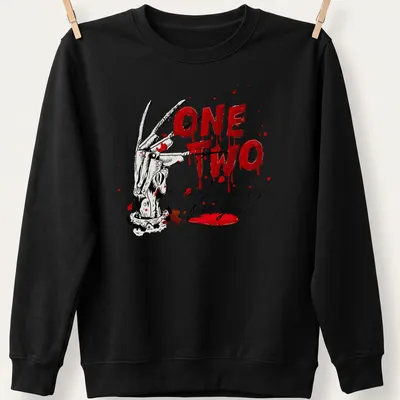 Illustration of a slasher glove with the text One Two Freddy's Coming For You in horror style — printed on a unisex sweatshirt