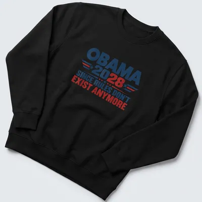 Bold political T-shirt featuring 'Obama 2028 Since Rules Don't Exist Anymore' in red, blue, and white typography — printed on a unisex sweatshirt