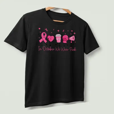 Kawaii cartoon t-shirt with pink ribbon, heart, boxing glove, and text promoting breast cancer awareness. — printed on a unisex t-shirt (angled view)