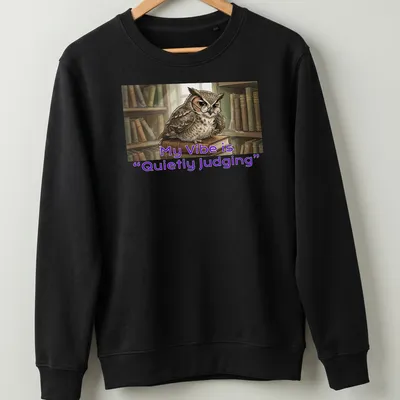 Illustrative owl t-shirt featuring the phrase 'My Vibe is Quietly Judging' in playful font — printed on a unisex sweatshirt
