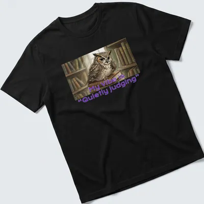 Illustrative owl t-shirt featuring the phrase 'My Vibe is Quietly Judging' in playful font