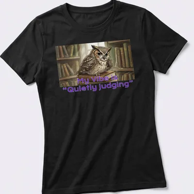 Illustrative owl t-shirt featuring the phrase 'My Vibe is Quietly Judging' in playful font — printed on a women's shirt