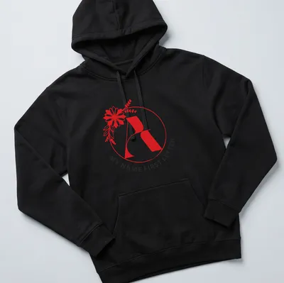 Floral initial letter print in modern typography with red, black, and white colors — printed on a unisex hoodie