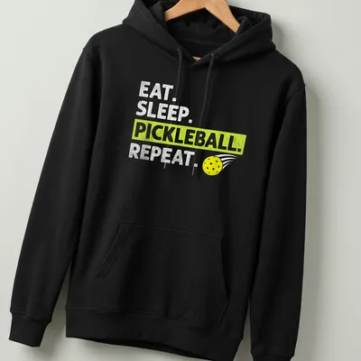 Bold typography t-shirt featuring Eat Sleep Pickleball Repeat in yellow, green, and white — printed on a unisex hoodie