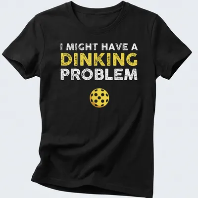 Funny pickleball shirt saying I Might Have A Dinking Problem in yellow and white — printed on a women's shirt