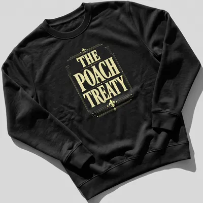 Vintage-style Pickleball t-shirt featuring the words 'The Poach Treaty' in yellow and white. — printed on a unisex sweatshirt