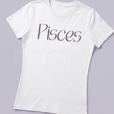Elegant Pisces zodiac sign t-shirt in serif font with brown and white colors — printed on a women's shirt