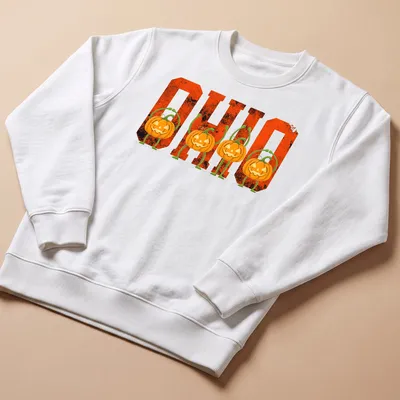 Vintage-style Halloween T-shirt featuring pumpkins and O H I O text — printed on a unisex sweatshirt