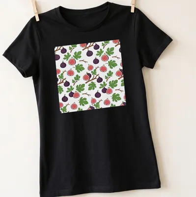 Illustrative design featuring purple figs with green leaves and pink accents. — printed on a women's shirt