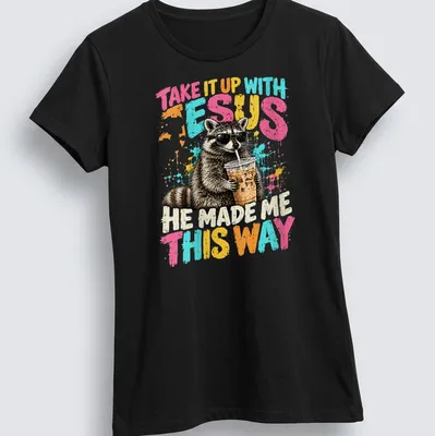 Cartoon raccoon wearing sunglasses with humorous text about faith. — printed on a women's shirt
