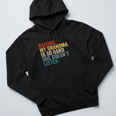 Humorous t-shirt with vintage distressed text about raising a grandma — printed on a unisex hoodie