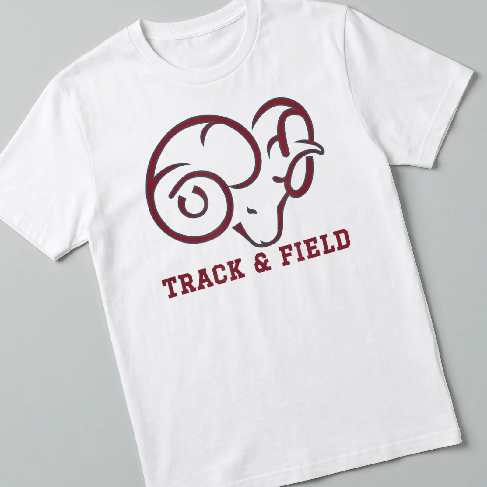 Bold graphic of ram with 'TRACK & FIELD' text on maroon and white — printed on a unisex t-shirt