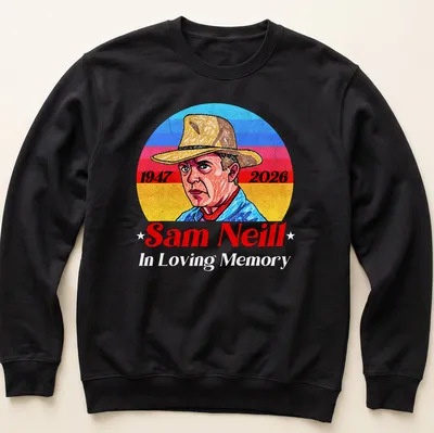 Vintage portrait tribute to Sam Neill with 1947 and 2026 dates in blue, red, yellow, and white. — printed on a unisex sweatshirt