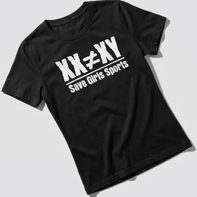 Bold typography on a black shirt stating 'XX Does Not Equal XY Save Girls Sports' in white — printed on a women's shirt
