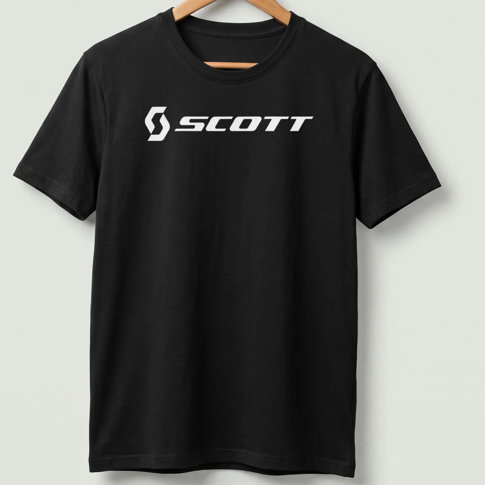Minimalist Scott Bike Logo T-shirt in white typography — printed on a unisex t-shirt