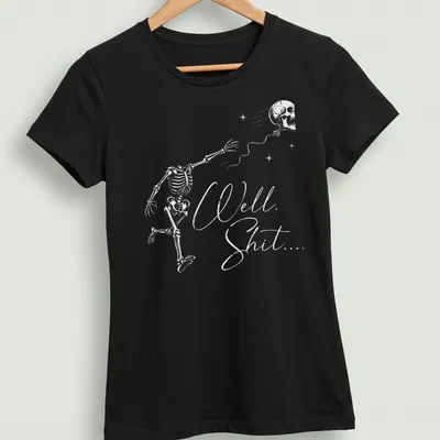 Funny dark humor t-shirt with a flying skeleton and text 'Well Shit...' — printed on a women's shirt