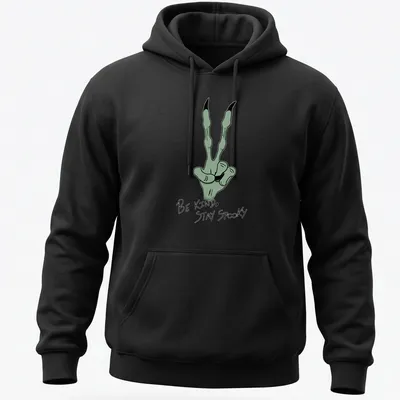 Cartoonish green hand gesture with 'Be Kind, Stay Spooky' text in black and white — printed on a unisex hoodie