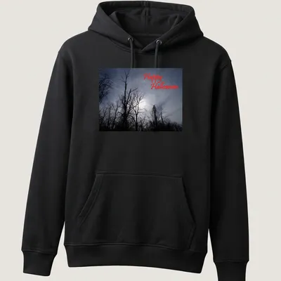 Photographic print of spooky trees with Happy Halloween text in red — printed on a unisex hoodie