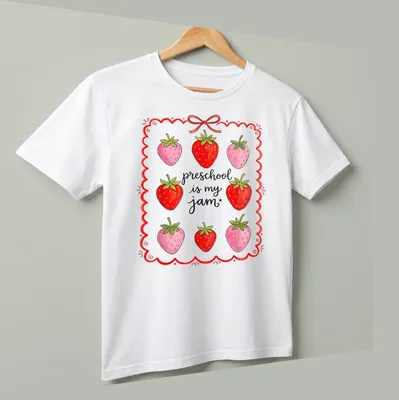 Colorful strawberry design with playful text celebrating preschool joy — printed on a unisex t-shirt (angled view)