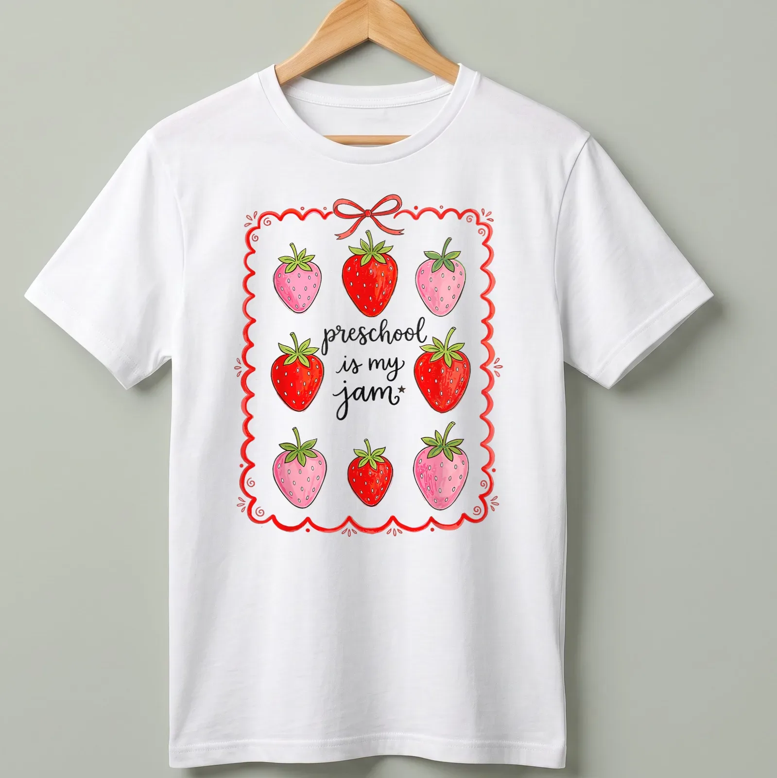 Colorful strawberry design with playful text celebrating preschool joy — printed on a unisex t-shirt